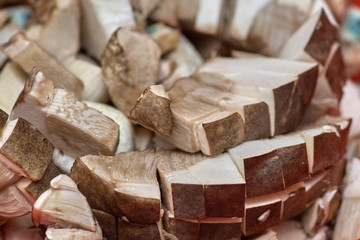Sliced fresh mushrooms boletus in a vegetable drier close-up