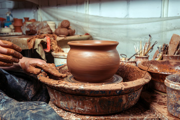 6415251 Potter at work. Workshop place.