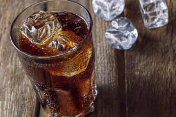 A glass with ice and cola.