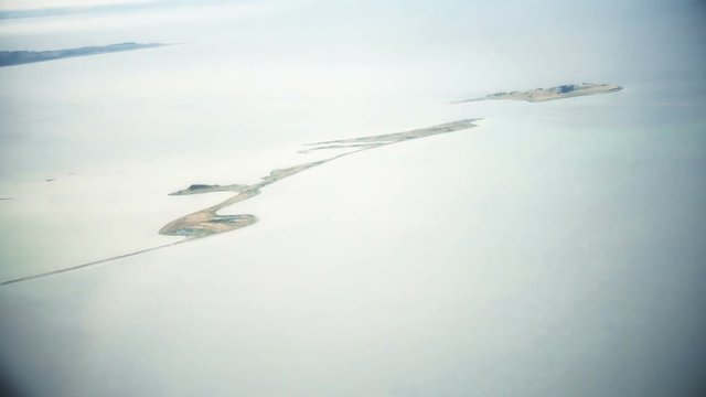 Esses flourishes slim character bright blue lonely island on water