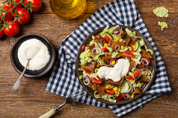 Gyros, kebeb. Salad with mutton and vegetables.