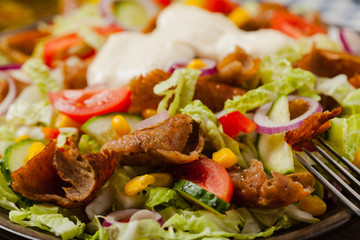 Gyros, kebeb. Salad with mutton and vegetables.