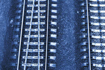 Obraz premium Speed and vertigo on railroad in blue tones. Railway abstract monochrome background with copy space.
