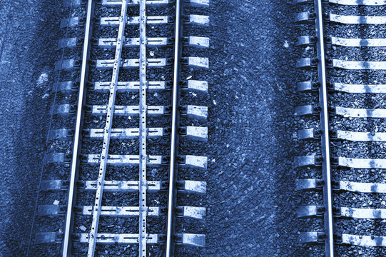 Speed And Vertigo On Railroad In Blue Tones. Railway Abstract Monochrome Background With Copy Space.