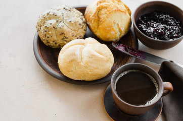 Simple breakfast: coffee americano, fresh buns and jam.