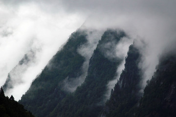 Clouds and fog on a mountain slopes