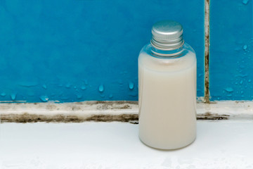 mold in bathroom, shampoo bottle in a dirty bath