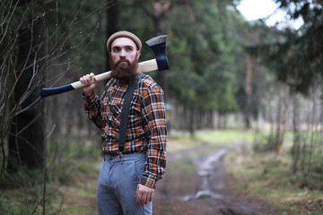 A bearded lumberjack with a large ax 