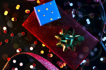 Top view of festive background with gift wrapping and confetti