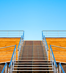 Stairs to the tribune or podium on a background of blue sky.