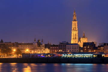 Beautiful cityscape of the skyline of Antwerp, Belgium, during the blue hour seen from the shore of the river Scheldt