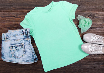 Mint T-shirt on a Dark Wooden Background