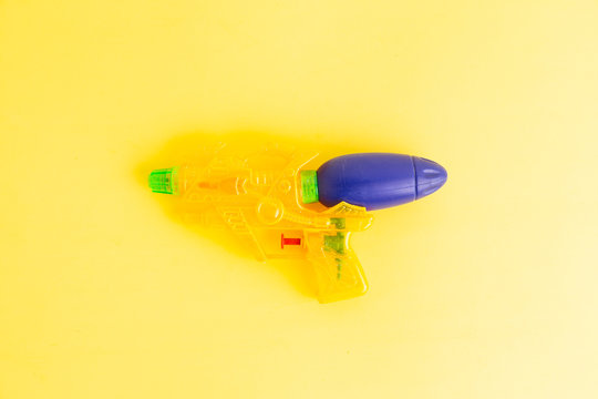 water gun on colorful background