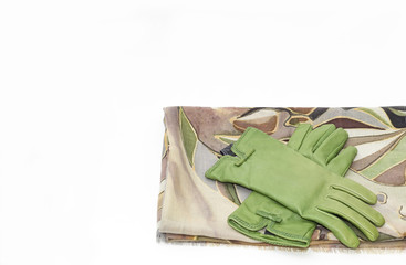 woolen scarf and green leather gloves