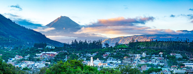 Panorama of town and volcano during sunrise in Andes of Ecuacor - obrazy, fototapety, plakaty