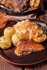 classic and crispy roasted duck with cabbage and dumplings