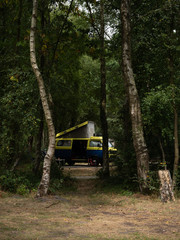 Camping van in the woods