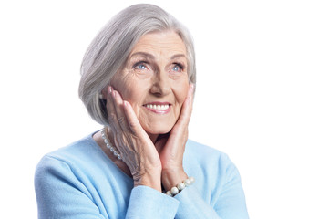 beautiful senior woman posing on white background