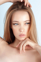 Fototapeta premium Young beautiful girl with clean perfect skin close-up
