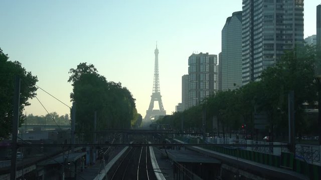 Morning view of eiffel tower and a train station at Paris, France