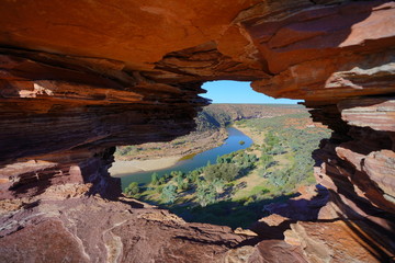 a view from the middle of hollow rock formation facing a river in the kalbarri western australia at daylight