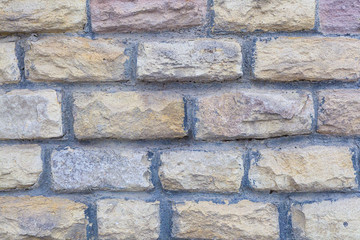 rectangular stone uneven crocheted limestone cobblestone with cement lines between blocks light beige wall base