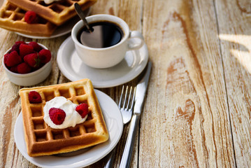 Belgian waffles with raspberry for breakfast