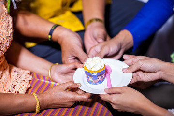  wedding cakes on dish. Bride and groom giving slice of wedding cake to guest. sign of wedding ceremony and sign of  wedding ceremony process ending.