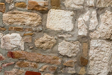 old calcareous stone white brown square rectangle cement part of old defensive wall light background foundation