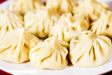 A dish of khinkali, a traditional georgian dumpling. Close-up photo
