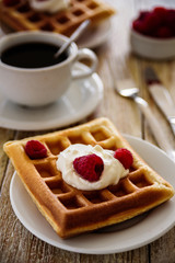 Belgian waffles with raspberry for breakfast