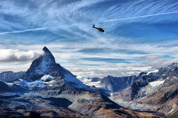 escue helicopter over the Matterhorn mountain