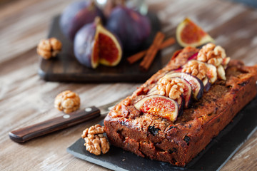 Homemade delicious fig cake with nuts on board