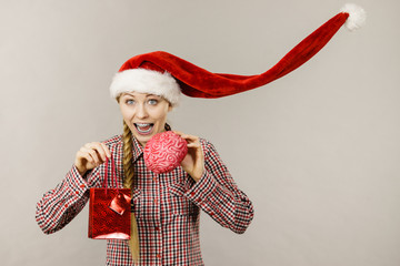 Christmas woman holding shopping bag and brain