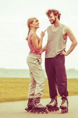 roller skater couple skating outdoor