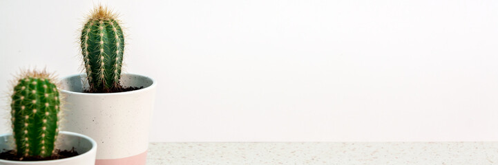 A panoramic photo of terrazzo desk on a white empty wall copy space background with isolated...