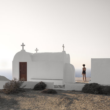 Serenity - landscape and woman by a church on the Greek islands