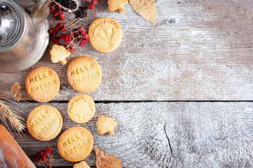 Fototapeta na wymiar Autumn decoration and homemade cookies for tea with the inscription 