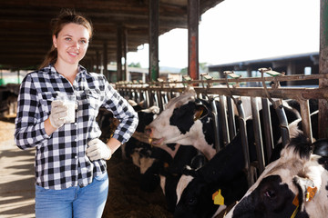 Fototapeta na wymiar Woman with glass of milk on farm