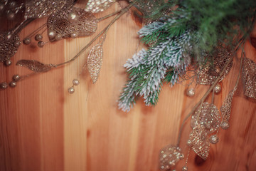 Christmas background with pine spruce fir branches with shiny toys and fir-tree tinsel