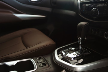 closeup automatic gear in new car with soft-focus and over light in the background