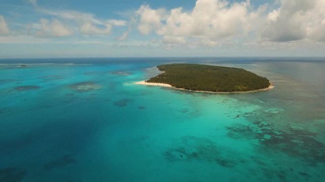 aerial footage tropical island with beach and palm trees lagoon with turquoise water Sea tropical landscape Daco island, Philippines, Siargao. Travel concept Aerial video
