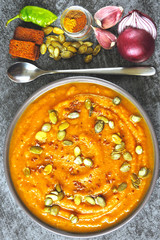Autumn pumpkin soup. Vegan cup with pumpkin soup. Soup with pumpkin and vegetables.
