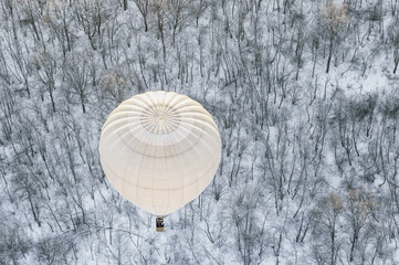 white hot air balloon in winter