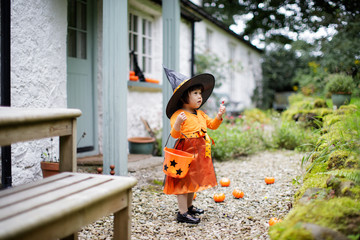 Toddler girl pretend playing Halloween party