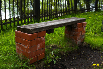 Bench of bricks and boards in the park