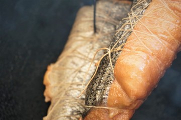 salmon fillets during traditional smoking, closeup