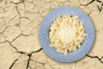 Grated Cheese on Pasta Isolated on White Background