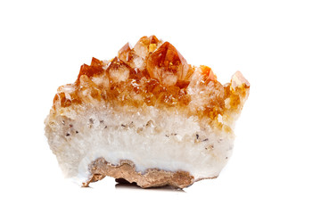 Macro mineral stone Citrine in rock in crystals on a white background