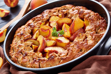 Peach Cobbler a deep-dish fruit dessert, good for the breakfast, cooked in advance meal, close up